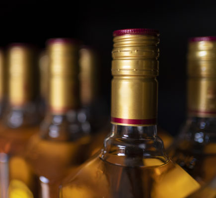 Labelled whisky bottles ready for packaging and export