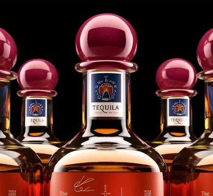 Hand-sealing tequila bottle during packaging