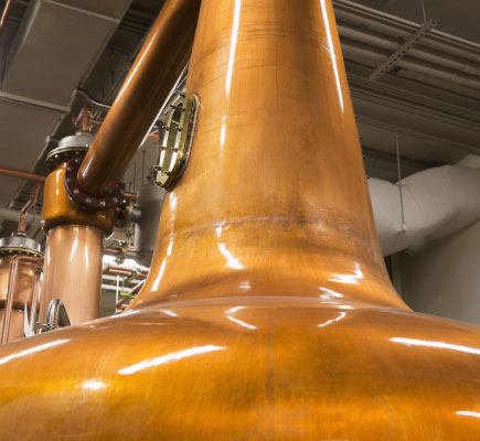 Copper pot stills in Scottish whisky distillery